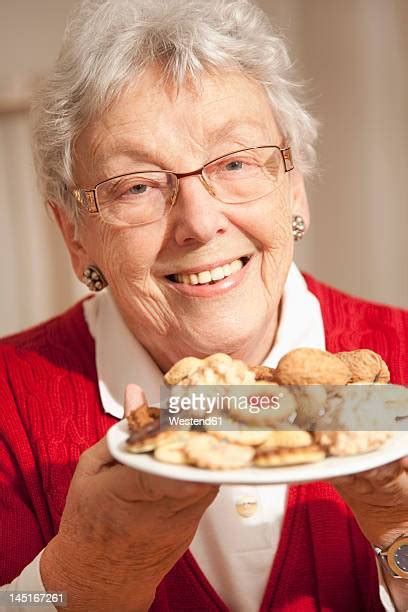 Old Woman Holding Plate Photos And Premium High Res Pictures Getty Images