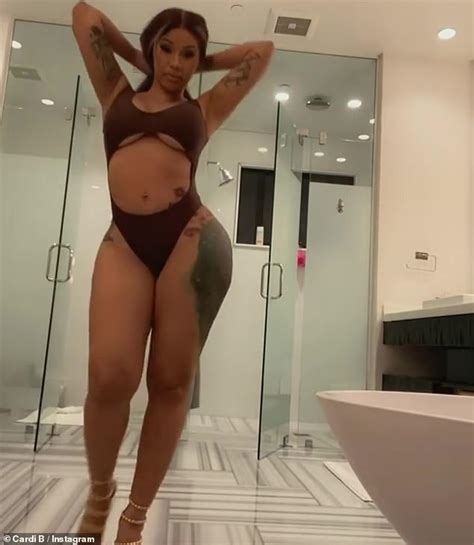 cardi b proudly puts her surgically enhanced b o d y on sh ow in very revealing one piece