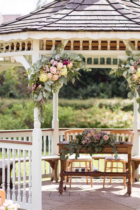 Wedding Gazebo Corner Floral Arrangements With Roses And Greenery