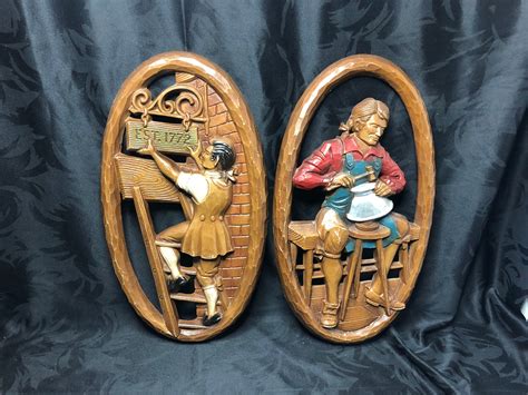 pair of cast metal wall plaques sexton etsy