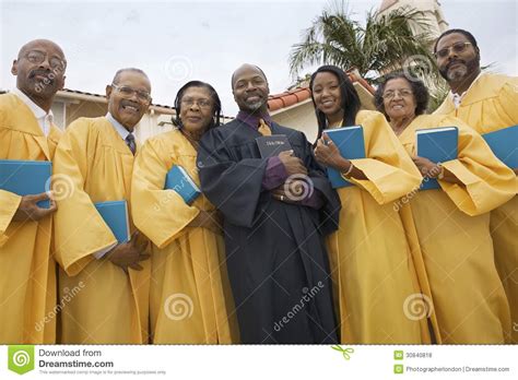 Preacher And Choir In Church Garden Portrait Low Angle View Stock Photo