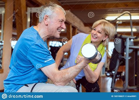 Senior Man Doing Dumbbell Exercise In The Gym Stock Image Image Of