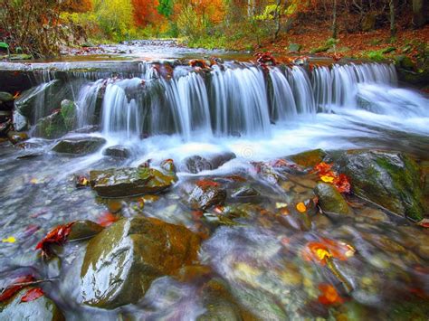 Mountain River With Rapids And Waterfalls At Autumn Time Stock Photo