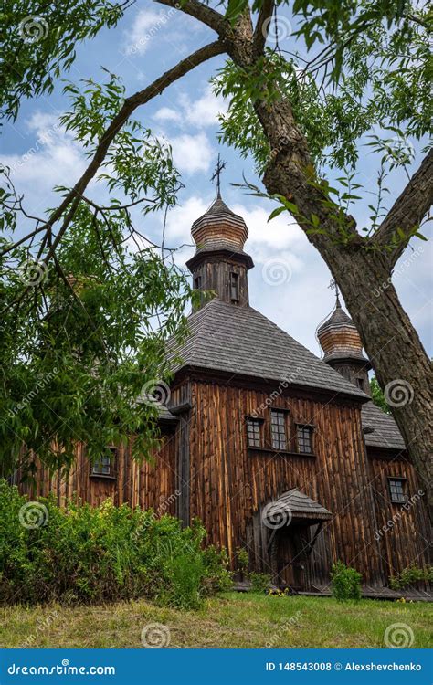 Orthodox Wooden Church In The Ukrainian Village Under Dramatic Skies
