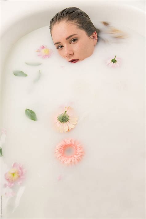 Woman Soaking In A Milk Bath By Stocksy Contributor Rzcreative