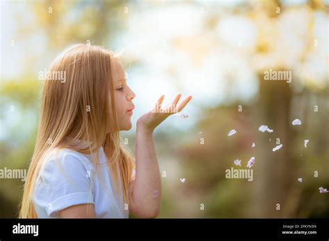 Pretty Eight Year Old Girl Outside In The Sunshine Smiling Stock Photo