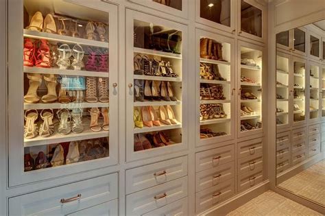 Chic Walk In Closet Features A Wall Of Floor To Ceiling Cabinets Fitted