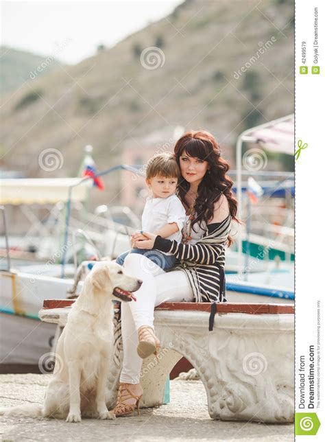 Mother And Son On The Waterfront With A Dog Stock Image Image Of