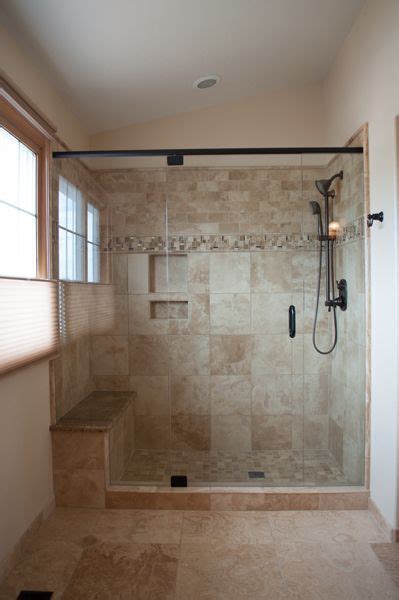 Hints of gray and blue in the white marble shower tile complement the bathroom's wall color. tile+showers+with+bench+and+shelves | ... tile, Moen ...