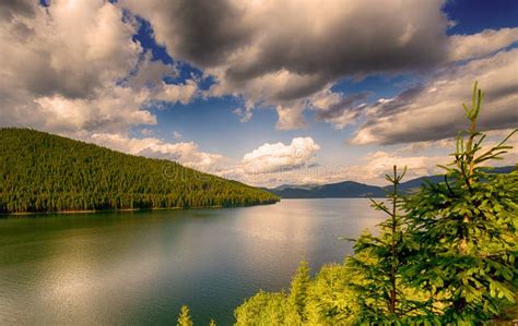 Mountain Lake Under Cloudy Sky Stock Photo Image Of Beauty Green