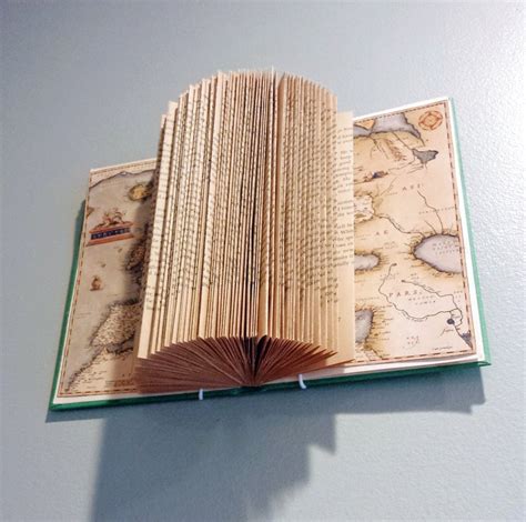 New Use For Old Books Fold Them Into Works Of Art The Daily Courier