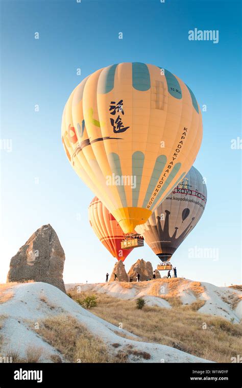 Colorful Hot Air Balloons Flying Over Fairy Chimneys In Nevsehir