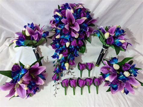real touch purple tiger lilies and roses with off white tulips and our famous blue galaxy