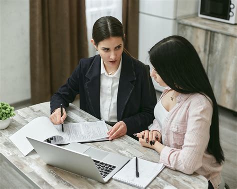 Female Lawyer And Client Doing A Handshake · Free Stock Photo