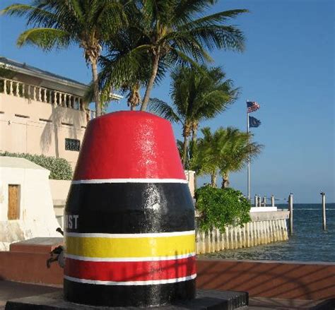 716 at the convergence of whitehead and south streets on the south coast of key west, florida, sits an enormous concrete monument. Southernmost Point in the Continental US