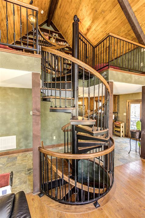 A stair is a set of steps designed to provide as easy and quick access to different floors inside the building. Rustic Loft Spiral Staircase - Rustic - Staircase - Indianapolis - by Paragon Stairs