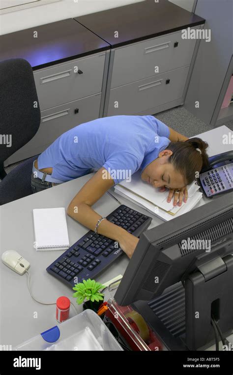 Person Slumped At Their Desk High Resolution Stock Photography And