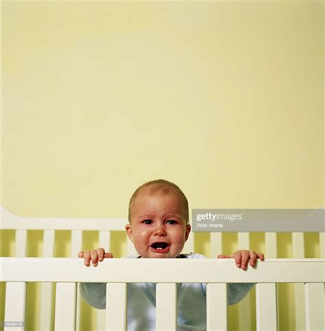 Baby Crying In The Crib High Res Stock Photo Getty Images