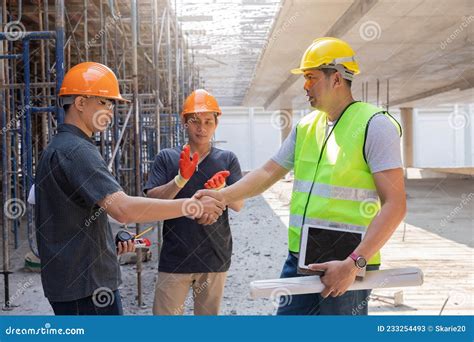Builders Handshake Architect And Contractor Agreement During Meeting