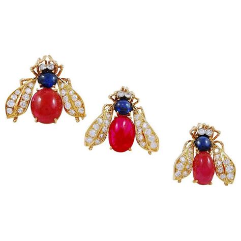 Van Cleef And Arpels Three Gold Cabochon Ruby Sapphire Diamond Bee