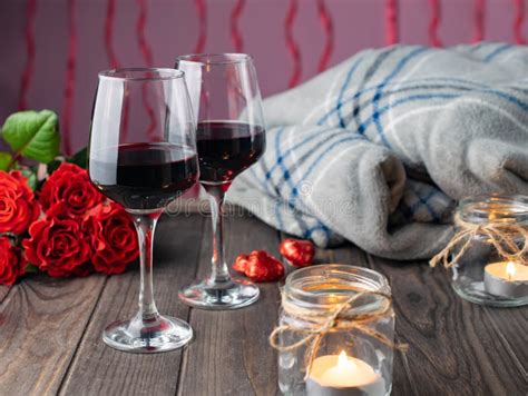 Romantic Cozy Evening With Wine Flowers Candles And Present Stock