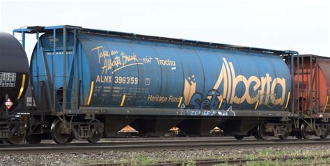 Distinctive Canadian Grain Hoppers Near End Of The Line Trains