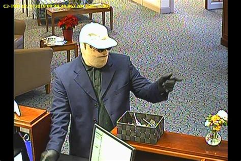 Masked Man Robs Bank With Finger And Threat
