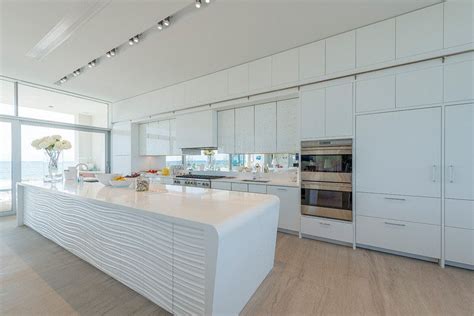 These kitchen cabinets are notable simple sliding doors on this white kitchen cabinet hide an adjustable shelf and base shelf. Kitchen Design Idea - White, Modern and Minimalist ...