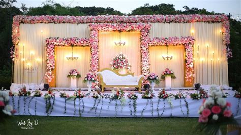 Dreamy Outdoor Reception Stage with Floral Arches