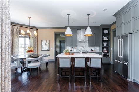 With the contrast between the different types of material in the cabinets and countertops with a wooden floor with nearly invisible panels and cabinets that round into each other, the room is flawless. Gray Moldings In Contemporary Kitchen Atmosphere Interior ...