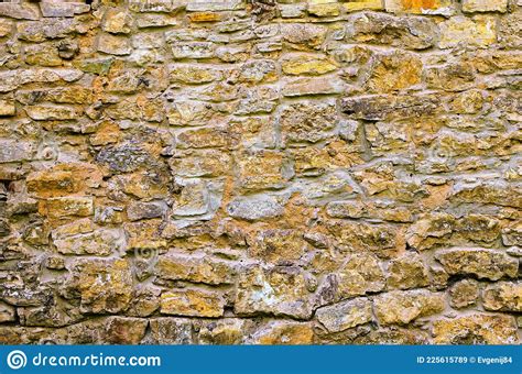 Texture Of Old Medieval Castle Wall With Loophole Made From Gray Stones