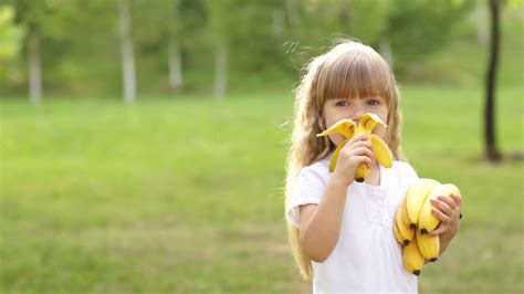 Girl Eating A Banana And Smiles Stock Video Footage 0008 Sbv 303492740