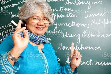 Cheerful Indian Asian Woman English Teacher In Classroom With