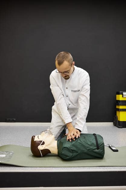 Premium Photo The Doctor Demonstrates First Aid Skills Heart Massage