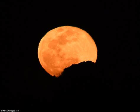 Pink Moon Lights Up The Sky As It Rises Close To Jupiter