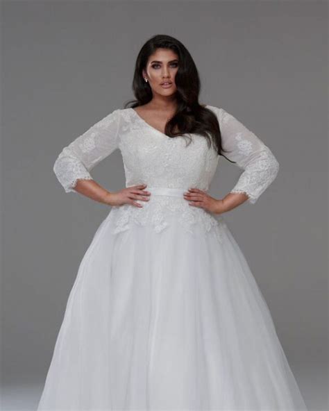 Strapless blush wedding dress with a ruffled skirt. Plus size wedding dresses with sleeves The Tanya - Plus ...