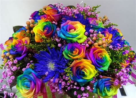 Rainbow Rose Mixed With Some Other Flowers In An Aqua Bouquet Rainbow Roses Floral Wreath