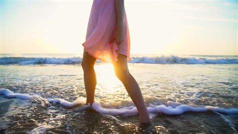 Legs Of Hispanic Girl Walking Barefoot Wet Sand Island Beach Sun Lens