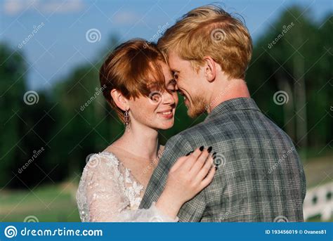 Nice Redhead Young Just Married Happy Couple Kissing In The Sunset Outdoors Stock Image Image