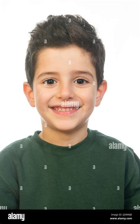 Handsome 6 Years Old Boy Looking At Camera Smiling Against White