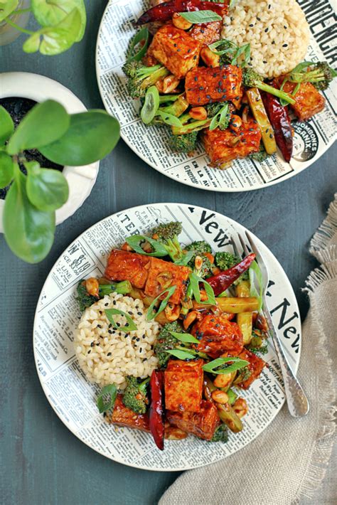 Broccoli and tofu are tossed in a spicy black bean sauce in this quick and easy chinese stir fry! Kung Pao Tofu with Broccoli - Two of a Kind