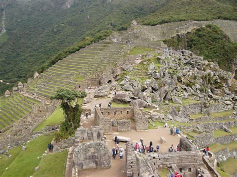 Tourists Visiting The Ruins Of Machu Picchu Peru Image Free Stock