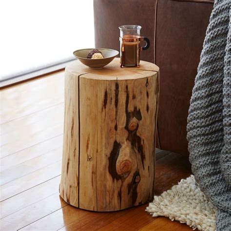 Make holes in the tree stump for inserting the wheels. Tree Stump Furniture | Designs & Ideas on Dornob