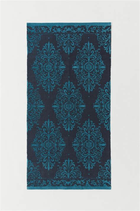 Teppich jute beige grun blattmuster 140 cm incik beliani de. Teppich h&m | Baumwollteppiche, Teppich, Einfarbige teppiche