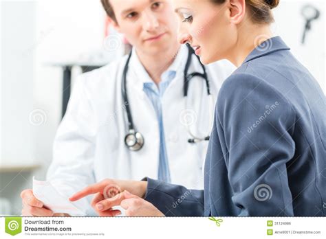 Doctor With Patient In Clinic Consulting Stock Photo Image Of