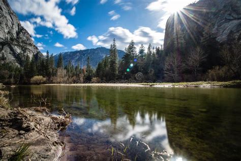 Reflections Of Trees And Mountains In Mirror Lake Located In Yosemite