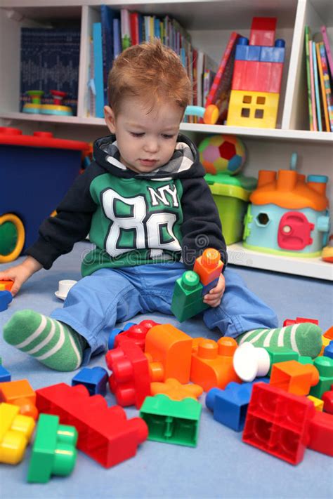 A Baby Boy Playing With Plastic Blocks Stock Image Image Of