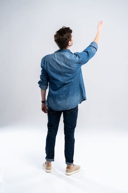 Premium Photo Back View Of A Casual Man Standing