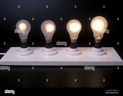 Four Different Wattage Light Bulbs 40w 60w 100w 150w Stock Photo