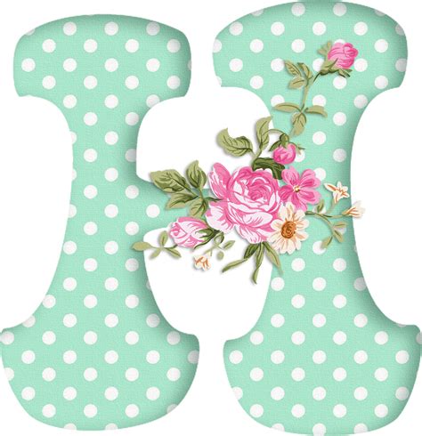 An Alphabet Of Pale Green Letters With White Polka Dots And A Spray Of